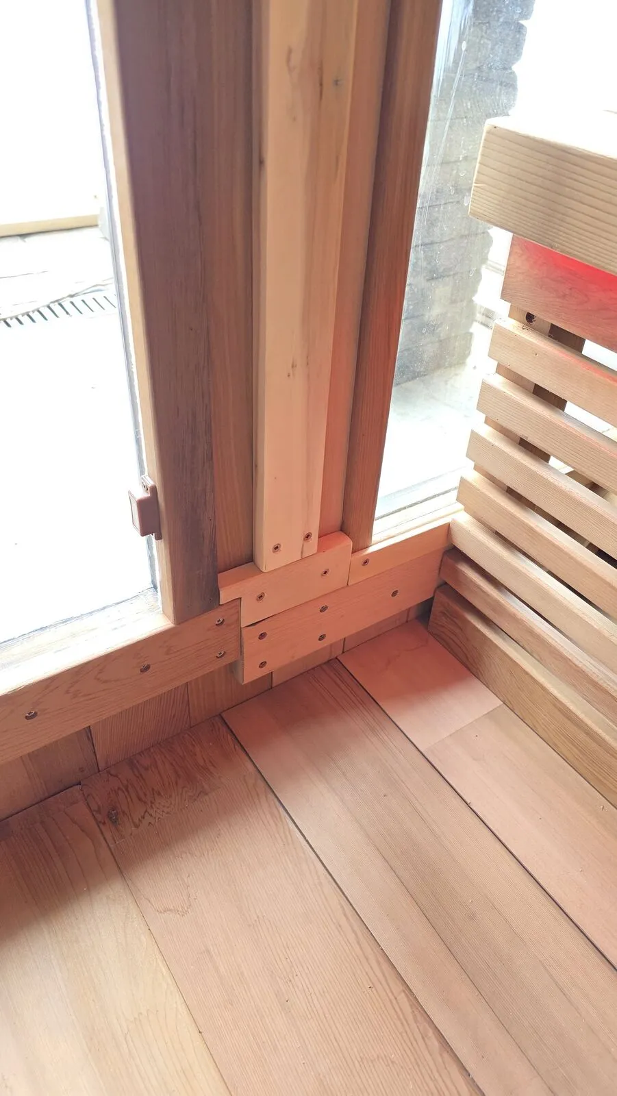 Backyard sauna under the covered patio — finished