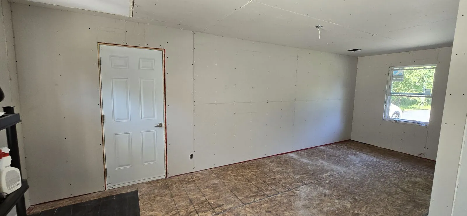Garage converted to a living space, with new siding — finished (2)