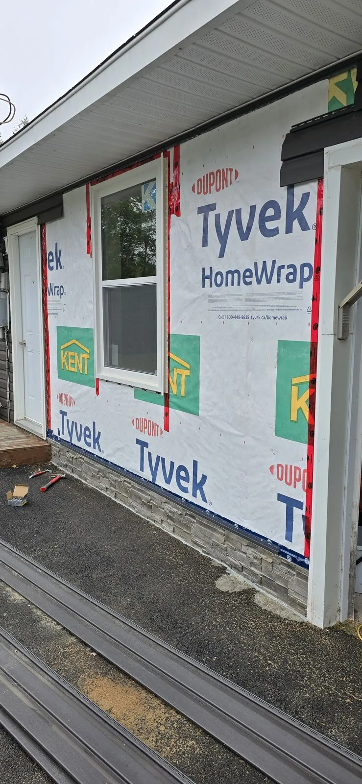 Garage converted to a living space, with new siding — finished (3)