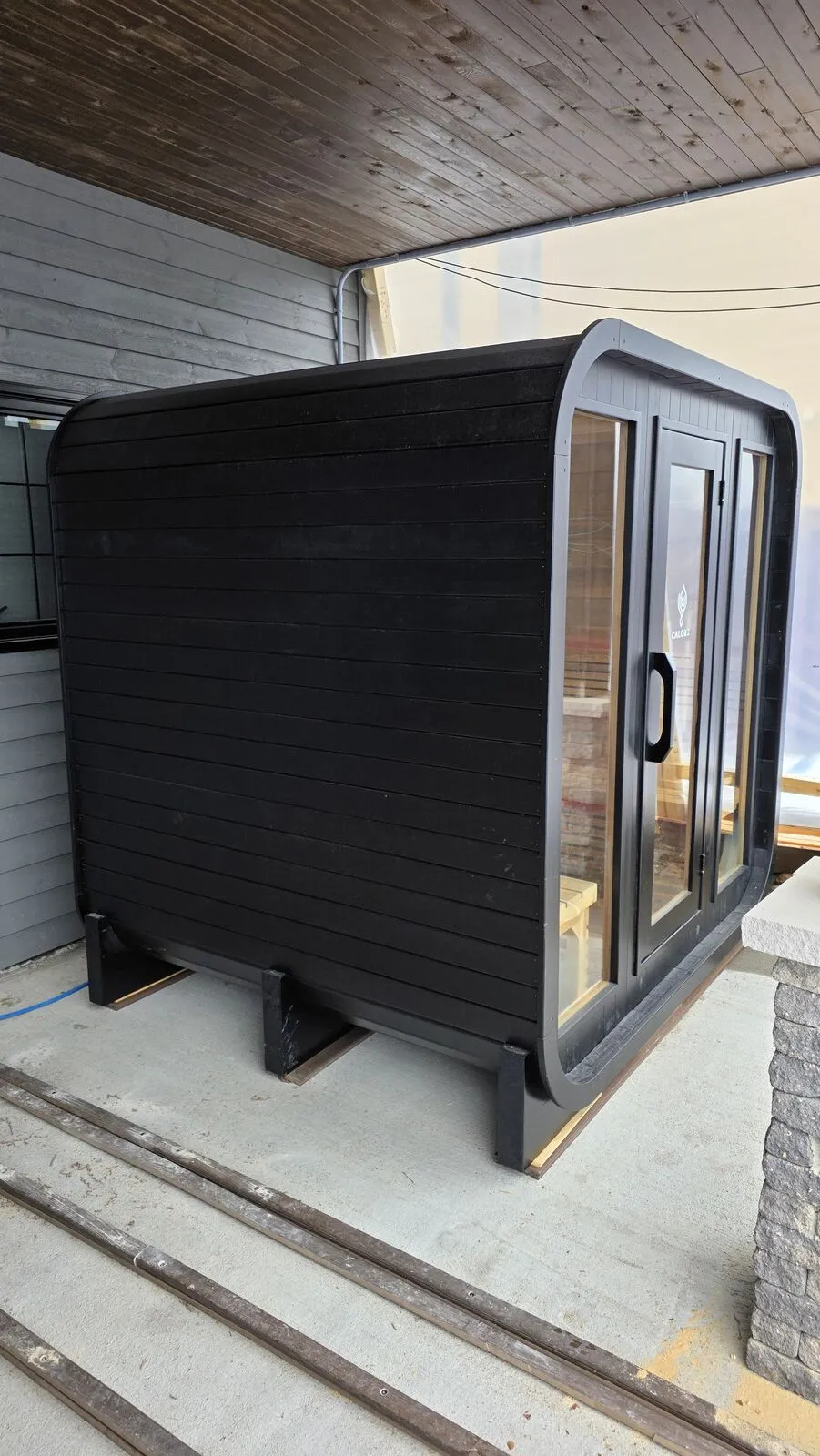 Backyard sauna under the covered patio
