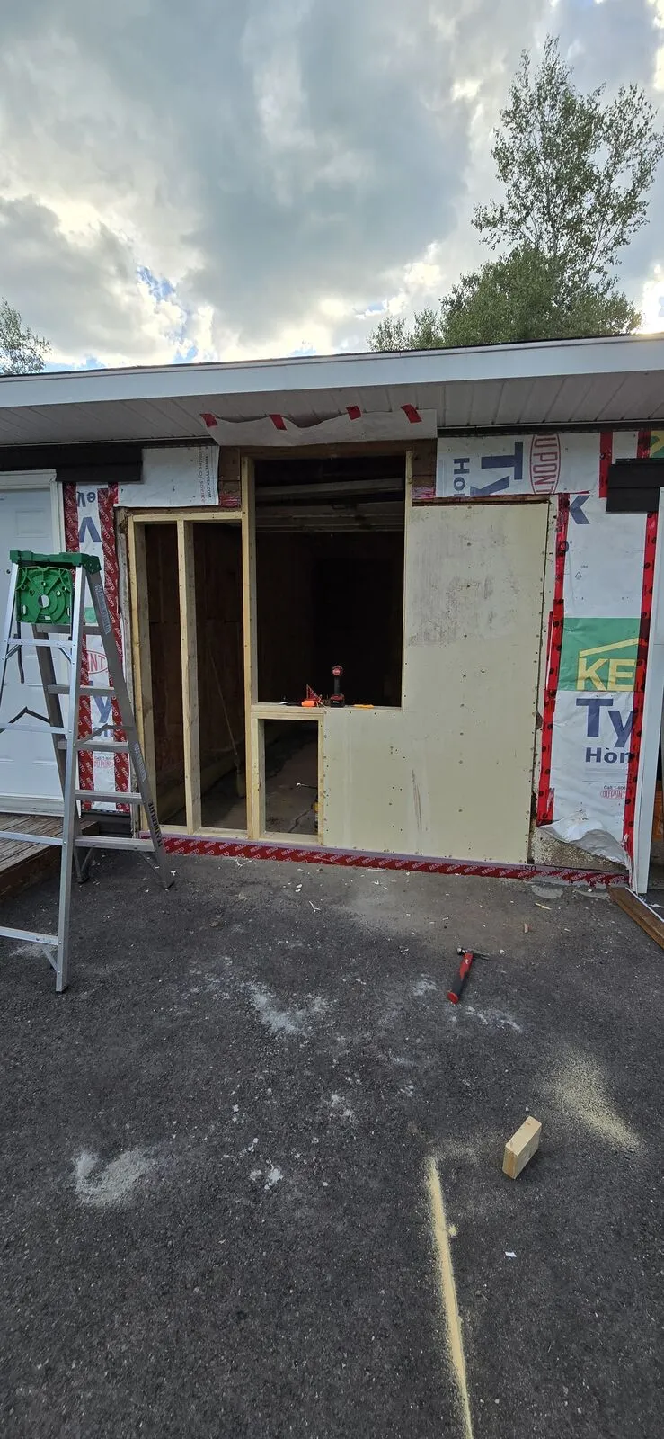 Garage converted to a living space, with new siding — work in progress (8)